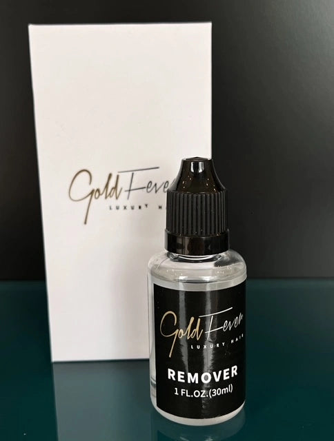 A small, transparent bottle with a dropper applicator, containing a gentle yet effective solution that effortlessly dissolves the bond created by the V-Light machine during the application of Gold Fever hair extensions, ensuring quick and easy removal without causing damage to the natural hair.